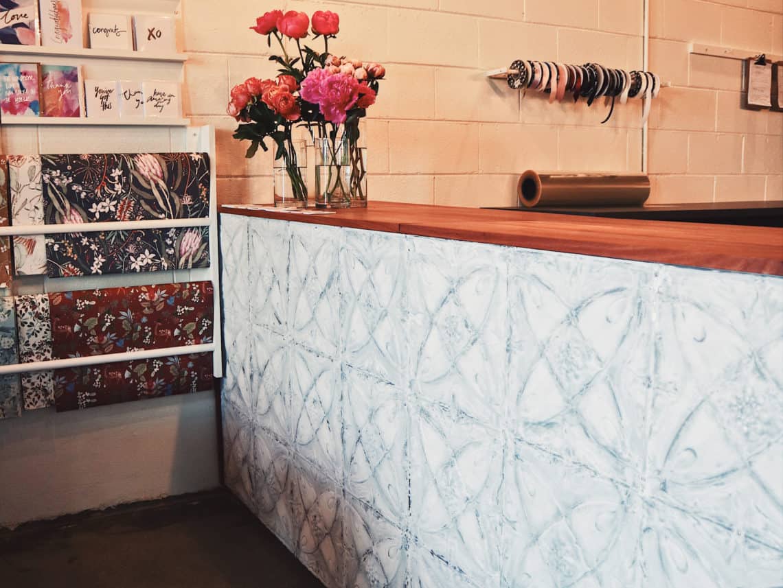 Pressed tin counters at Unveiling Poppy Florist