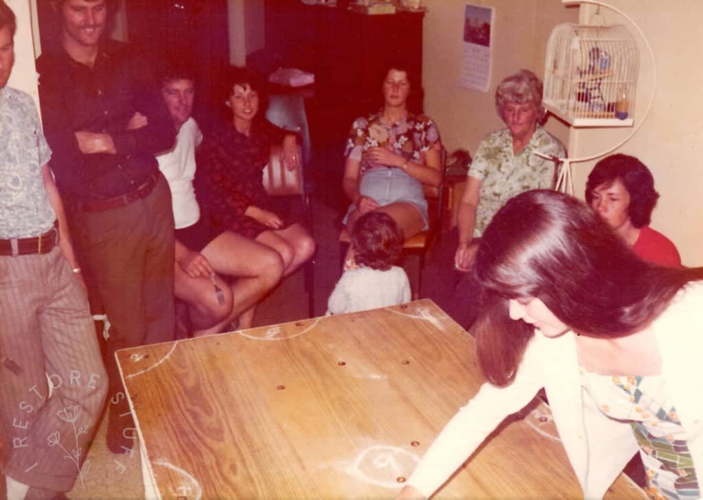 coin pool being played on the Jackson family table.