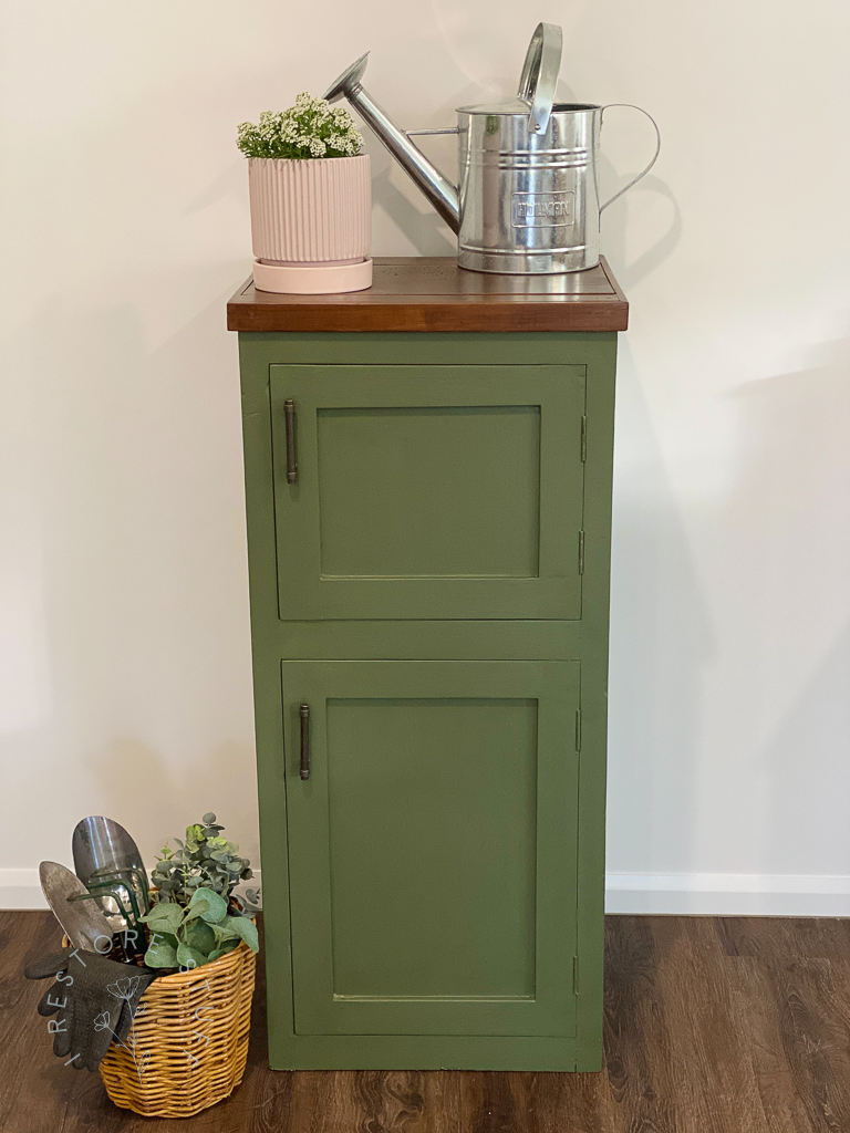 Bayberry garden cupboard styled with watering can