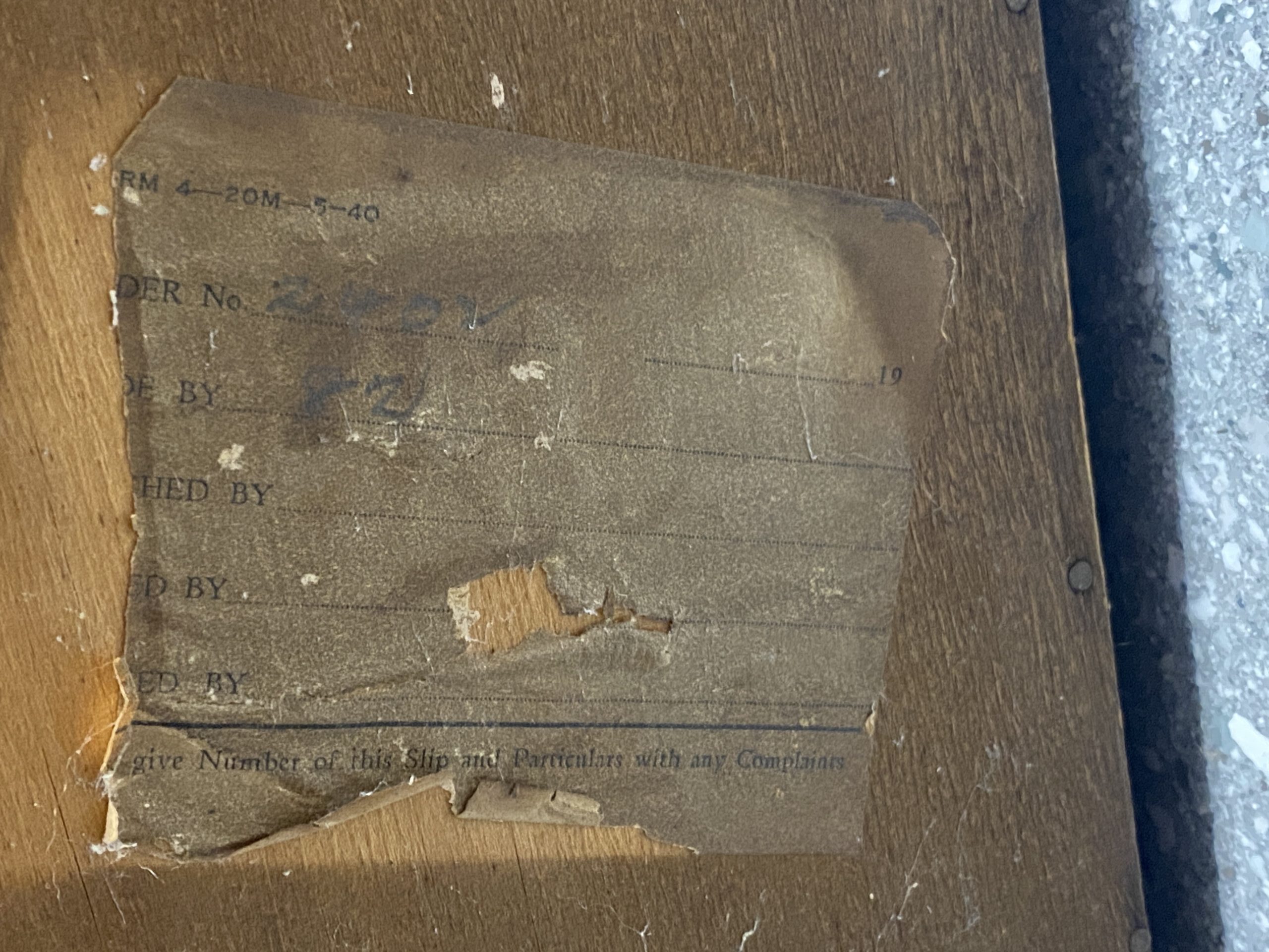 vintage torn label on blanket box base