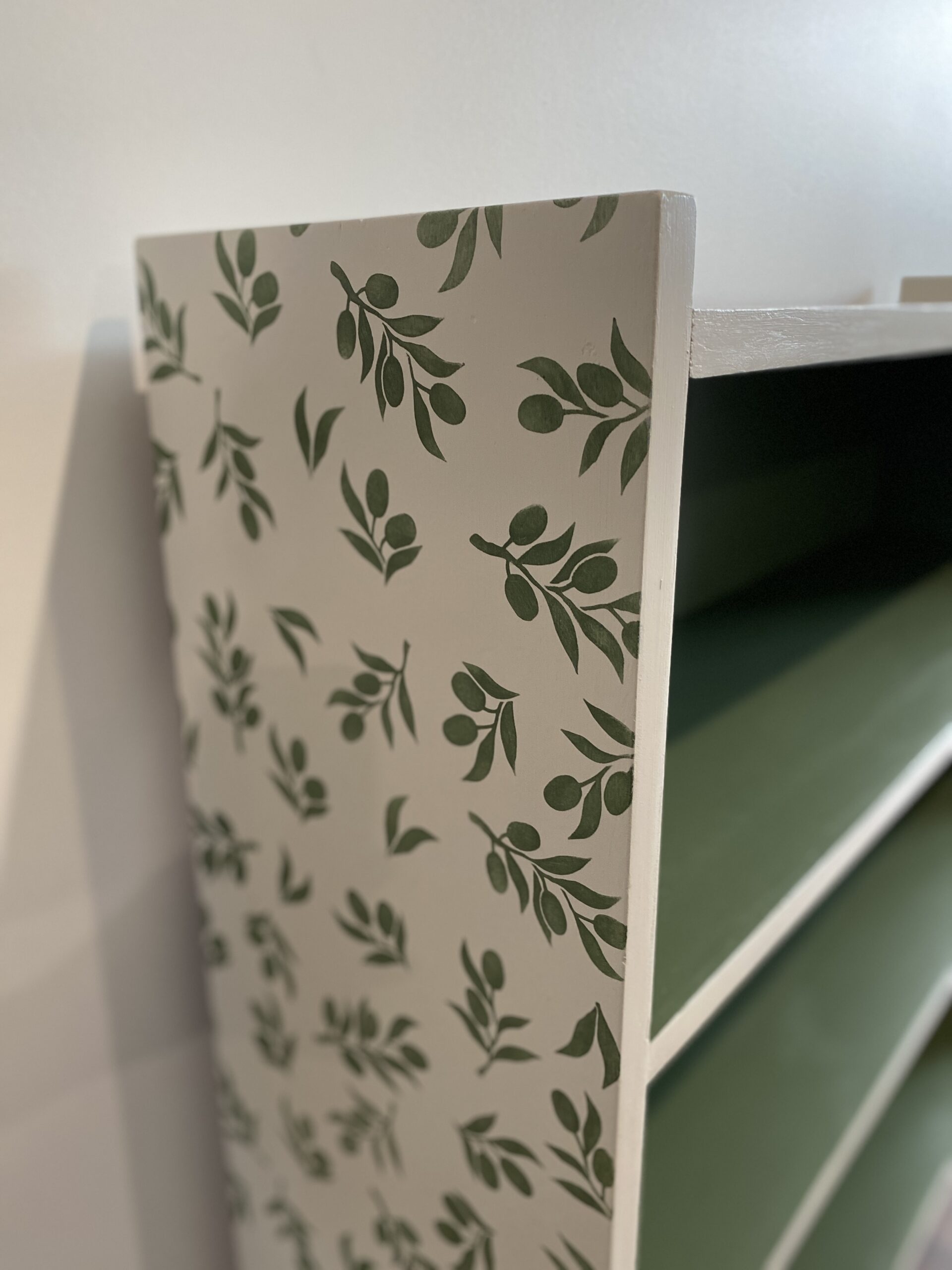 stenciled side of bookcase