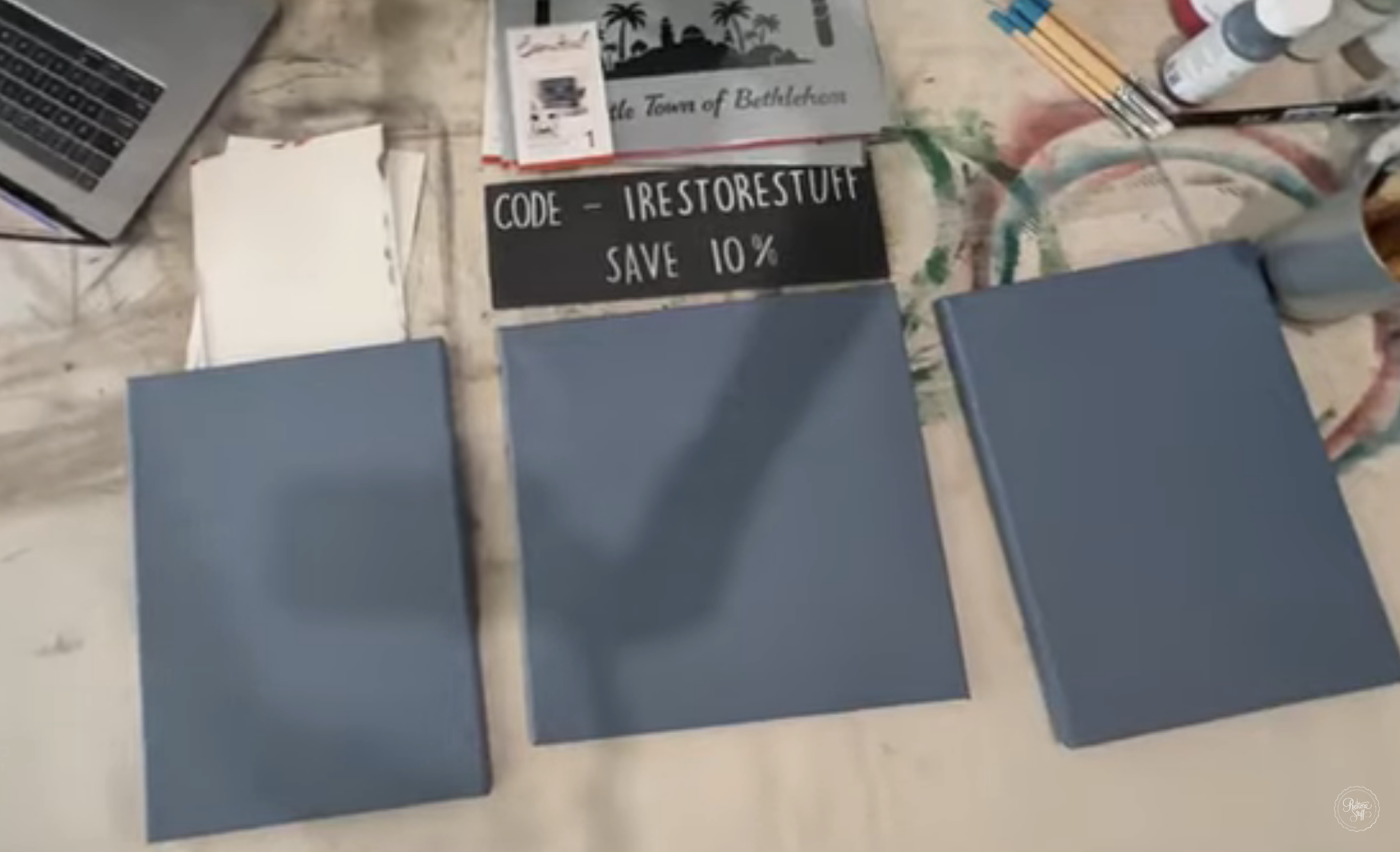 3 canvases with blue alchemy background